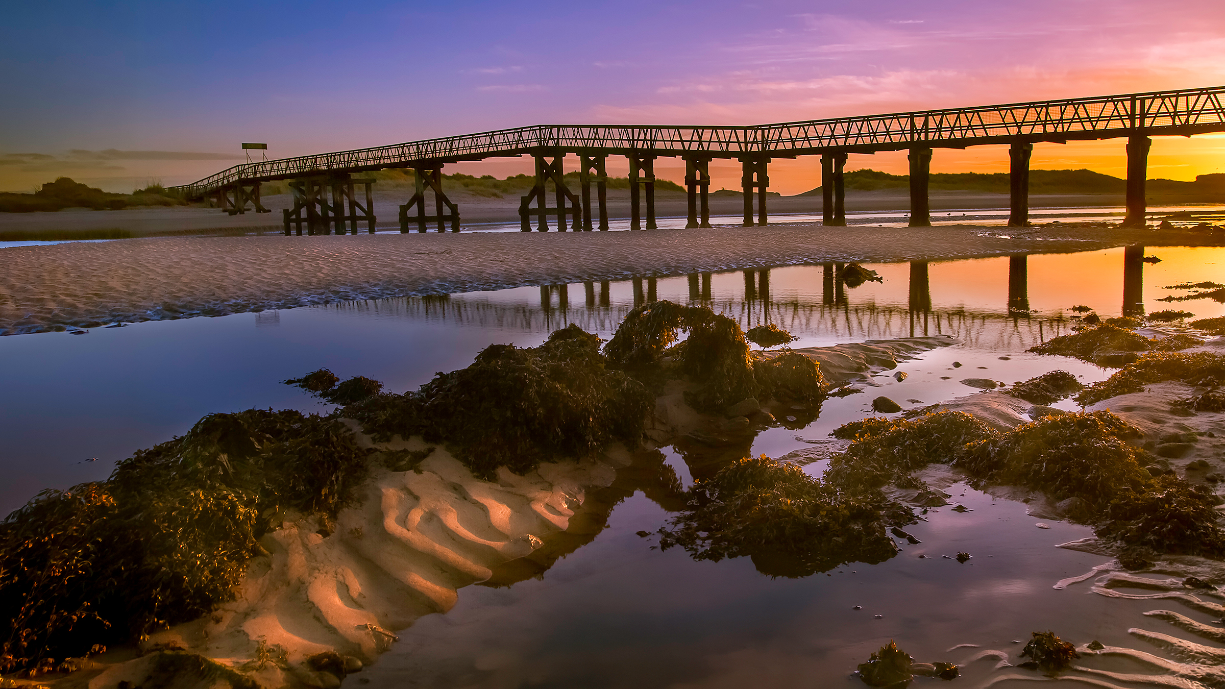 Sunset over the old Lossiemouth footbridge, Moray coast